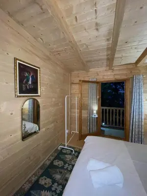 a bedroom with a bed in a room with a window at Ranc Mujica in Bar