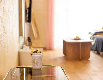 a cup with a banana on top of a table at Krizor Apartman Budva in Budva