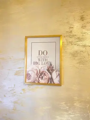 a picture of a framed picture of flowers on a wall at Krizor Apartman Budva in Budva