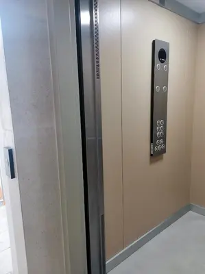 a elevator with a door with a control panel at Design Apartment at CITY QUART in Podgorica