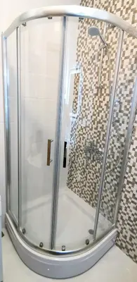 a shower with a glass enclosure in a bathroom at Design Apartment at CITY QUART in Podgorica