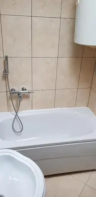 a bathroom with a toilet and a bath tub at Domador Rooms & Apartments in Budva