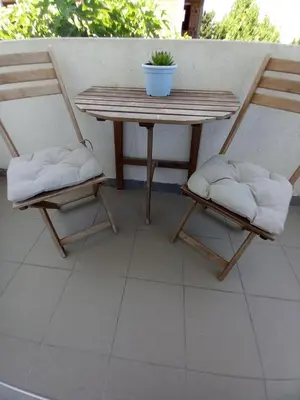 two chairs and a table and a table and chairs at Vila Nina Donji Štoj in Ulcinj