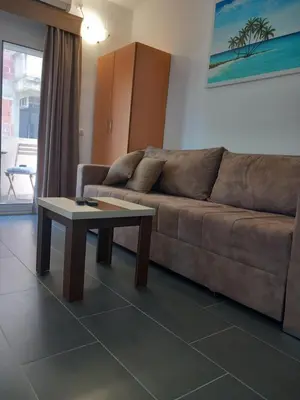 a living room with a couch and a coffee table at Vila Nina Donji Štoj in Ulcinj