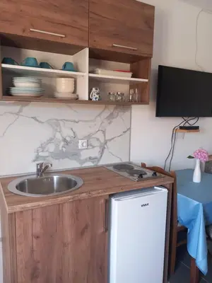 a kitchen with a sink and a counter top at Vila Nina Donji Štoj in Ulcinj