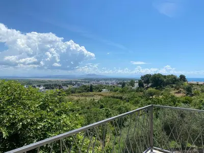 a view of the city from the top of a hill at Glass house in Ulcinj