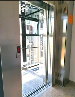 an elevator door with a window in a building at Vi studio city center 2min to sea in Bar