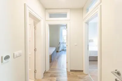 a hallway with a door leading to a bedroom at Sasha di Cattaro - Old Town Lux Apartment in Kotor