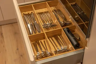 a drawer full of silver utensils in a kitchen at Sasha di Cattaro - Old Town Lux Apartment in Kotor