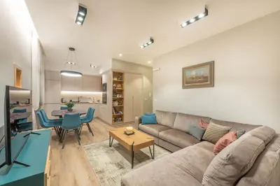 a living room with a couch and a table at Sasha di Cattaro - Old Town Lux Apartment in Kotor
