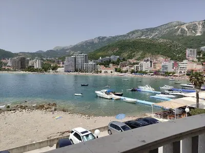 a view of a beach with boats in the water at Apartments Altea in Rafailovici