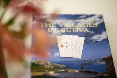 a book about the villages of bulgaria on a table at Amare Luxury Apartments in Budva