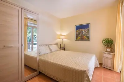 a bedroom with a bed and a glass door at Splendid Apartments in Budva
