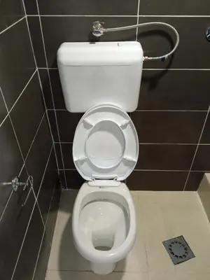 a bathroom with a white toilet in a stall at Monte room in Podgorica
