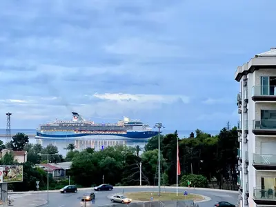 a cruise ship is docked in the water at Nevenka in Bar