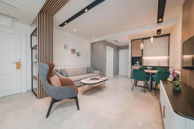 a living room with a couch and a table at Kalamper Apartments in Dobra Voda
