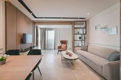 a living room with a couch and a table at Kalamper Apartments in Dobra Voda