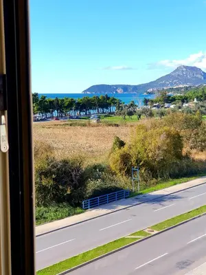 a view of a road from a train window at Aleksandar First Sea Line Apartment in Bar