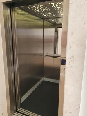 a shower with a glass door in a room at Aleksandar First Sea Line Apartment in Bar