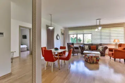 a living room with a couch and a table and chairs at Montesun Fontana Apartments in Budva