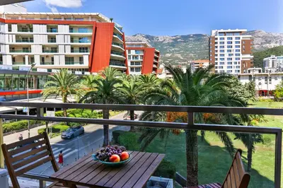 a bowl of fruit on a table on a balcony at Montesun Fontana Apartments in Budva