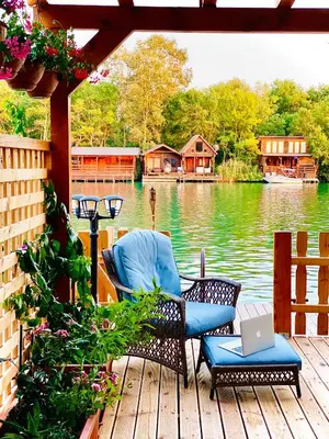 a deck with a chair and a laptop on it at Mery Ada House in Ulcinj