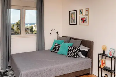 a bedroom with a bed with pillows on it at Les appartements Privés Bar in Bar