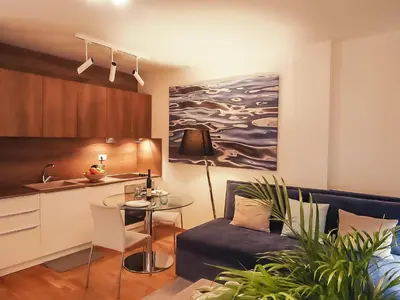 a living room with a couch and a table at Four Views Apartments in Budva