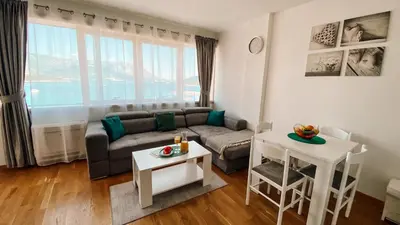 a living room with a couch and a table at Four Views Apartments in Budva