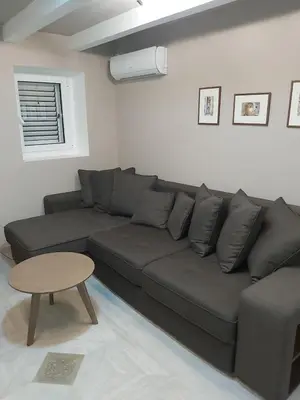 a living room with a couch and a table at Magnolia Lux Apartments in Budva