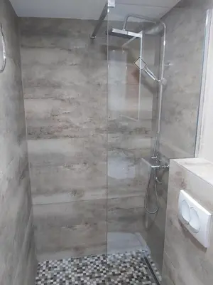a shower with a glass door in a bathroom at Magnolia Lux Apartments in Budva