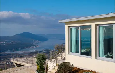 a house with a view of the water at Awesome Home In Kotor in Kotor