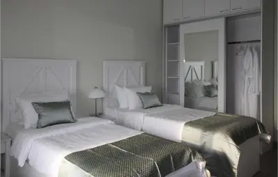 two beds sitting next to each other in a bedroom at Awesome Home In Kotor in Kotor