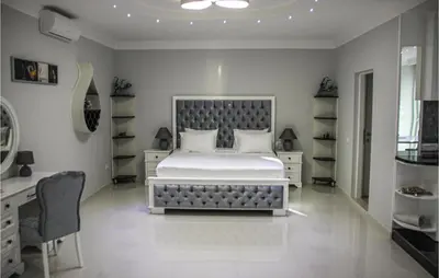 a bedroom with a large bed and a desk at Awesome Home In Kotor in Kotor