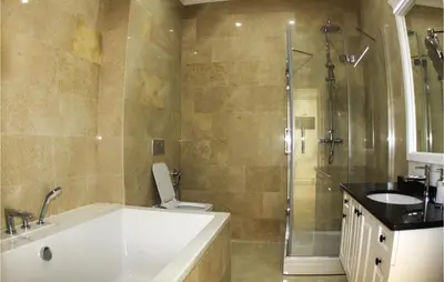 a bathroom with a tub and a toilet and a sink at Awesome Home In Kotor in Kotor