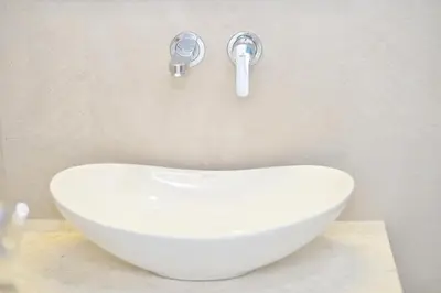 a white sink in a bathroom with a faucet at Villa Zen Hill in Petrovac na Moru