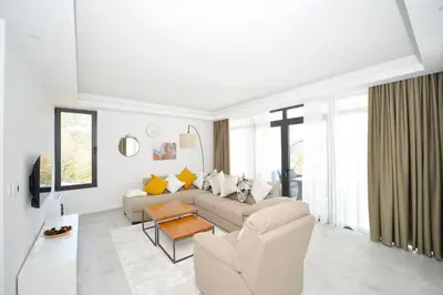 a living room with a couch and a table at Villa Zen Hill in Petrovac na Moru