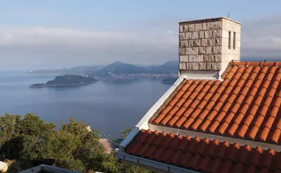 a view of the water from a roof of a building at Carsko Selo Blizikuce in Budva