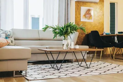 a living room with a couch and a table at Villa Panorama Hill in Dobra Voda