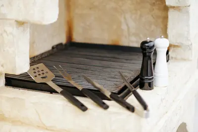 a group of knives and chopsticks on a wall at Villa Panorama Hill in Dobra Voda