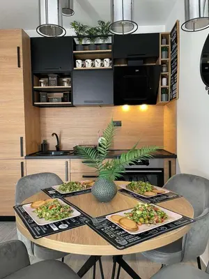 a table with plates of food on it in a kitchen at Blue berry apart in Budva