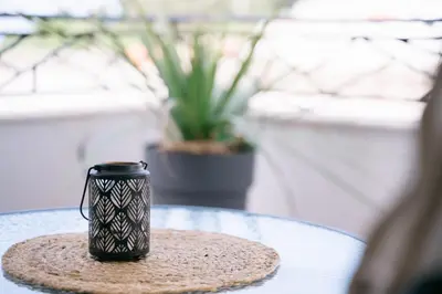 a black coffee cup sitting on a table at Apartments Lungo Mare Ulcinj in Ulcinj
