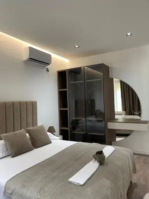 a bedroom with a bed with a towel on it at Casa Nita in Ulcinj