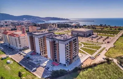 an aerial view of a city with buildings and the ocean at EmZa Sea View Apartment in Bar