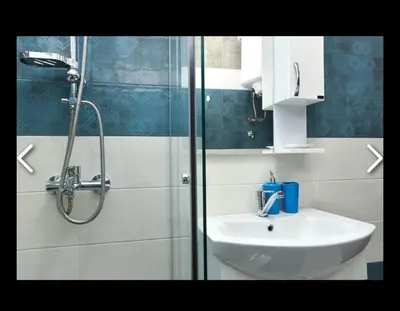 a bathroom with a sink and a shower at Apartments Teona in Bar
