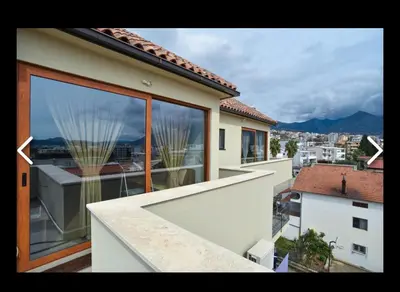 a building with a balcony with a view of a city at Apartments Teona in Bar