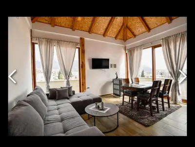 a living room with a couch and a table at Apartments Teona in Bar
