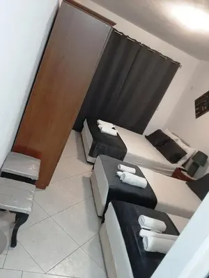 a room with two beds in a room at Villa Alba Apartments in Dobra Voda