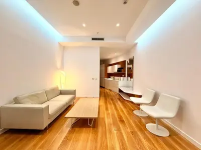 a living room with a couch and two chairs at Condo Studio Plaza in Budva