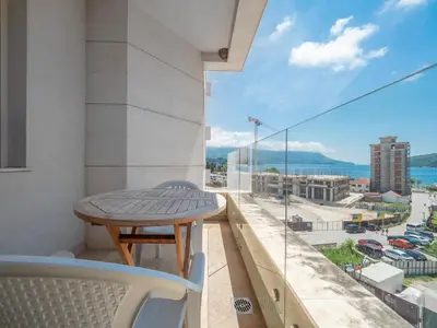 a balcony with a table and a view of the city at Seaside Rest Apartments in Budva